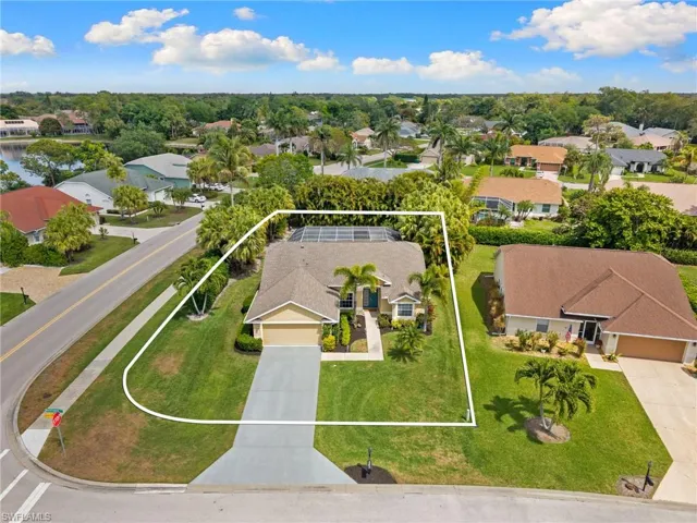 Corner lot aerial view of home