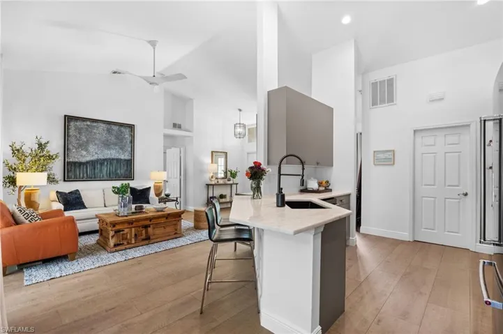 Partial view of the living room and kitchen