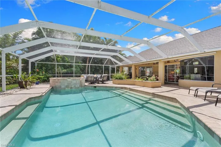 Your private oasis with a 38 ft long heated pool, spa and plenty of sitting areas