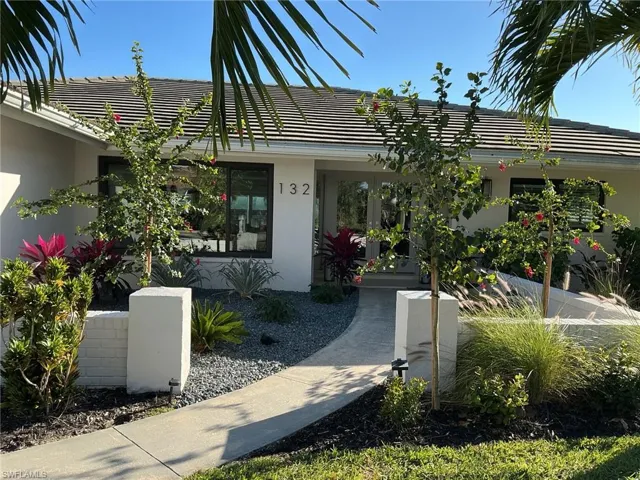 Property entrance featuring stucco siding