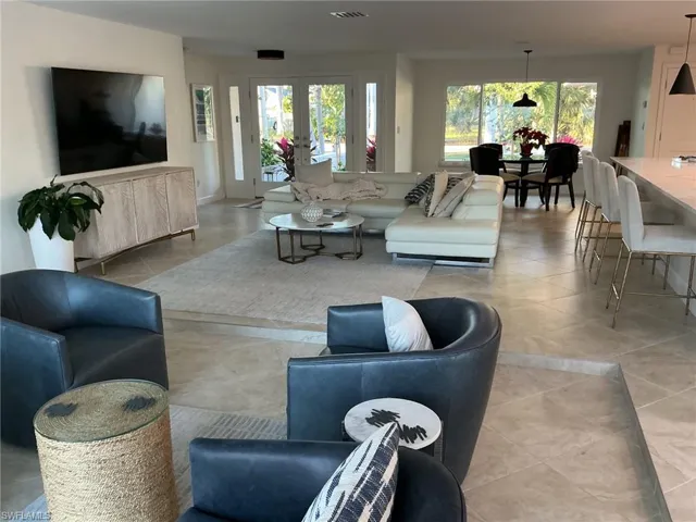 Living area featuring healthy amount of natural light and french doors