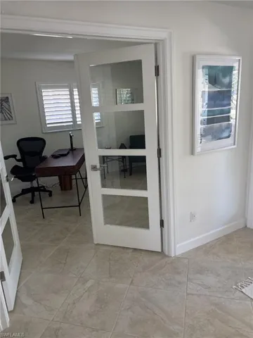 Office with baseboards and french doors