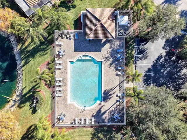 View of subject property featuring a pool area