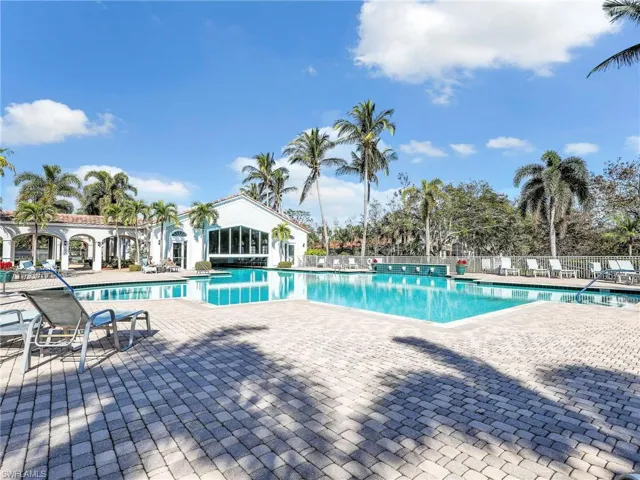 Community pool featuring a patio area