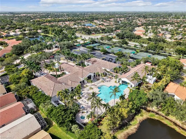 Aerial overview of property's location with a large body of water and nearby suburban area