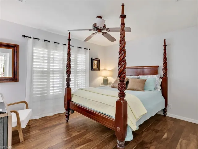 Bedroom featuring wood finished floors and a ceiling fan