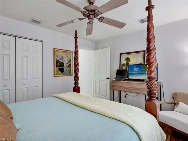 Bedroom with a closet and a ceiling fan