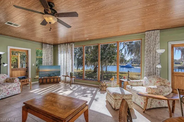 Great Room with beautiful views in every direction. Lovely boat going by.