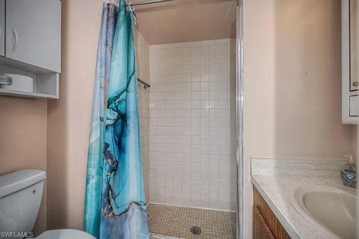 Bathroom 2 featuring vanity and a stall shower