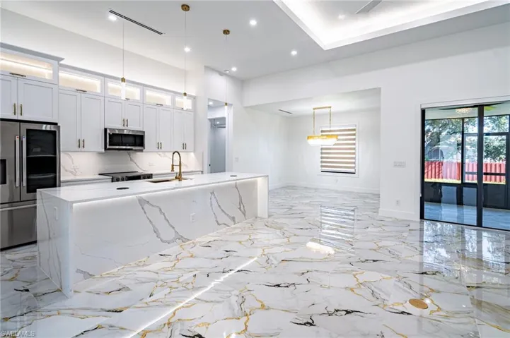 Gleaming large-format tile flooring with veining