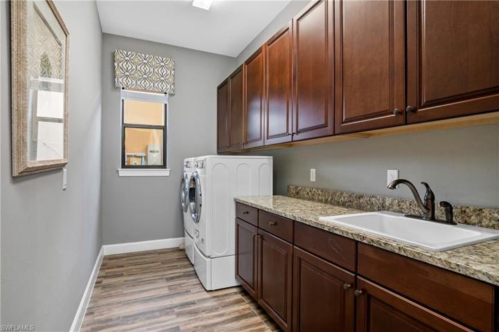 Laundry is a breeze in this large laundry room with lots of additional storage.