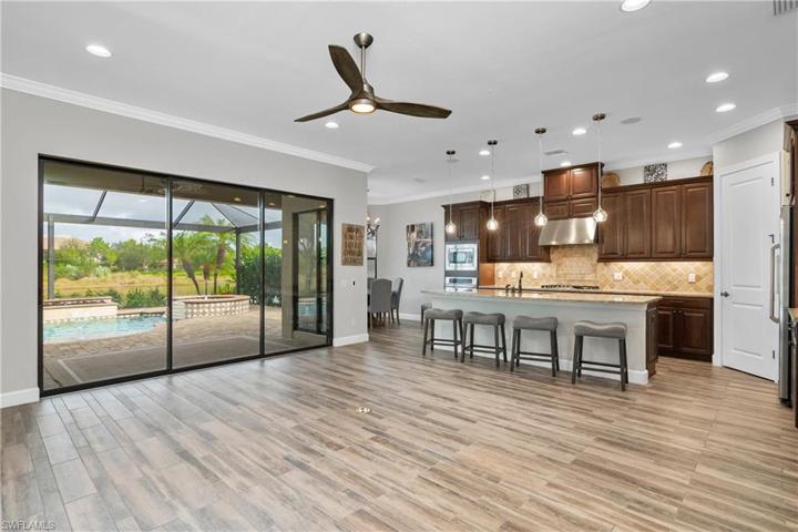 You'll LOVE this open floor plan which features and open great room, oversize island, eat-in breakfast cafe, and even a formal dining room just off the kitchen!