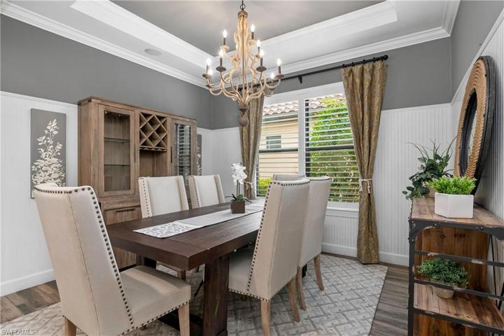 This formal dining room is the perfect spot for family gatherings. Note the attention to detail with the custom mill work, tray ceilings, and crown molding.