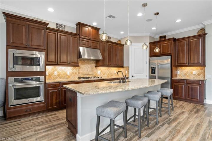 Prefer white cabinets? Current kitchen cabinets can be painted white for approx. $5000.00