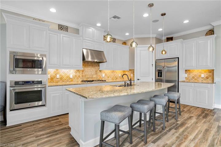 Prefer white cabinets? Current kitchen cabinets can be painted for approx. $5000.00 (photo digitally enhanced to show white cabinetry)