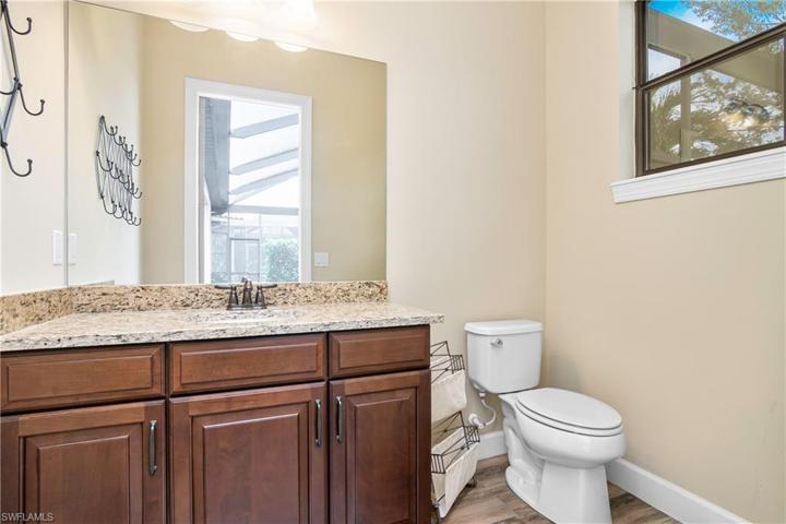 The additional half bath located poolside is great for outdoor entertaining.