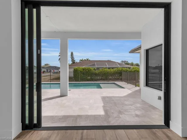 View of swimming pool with a fenced in pool
