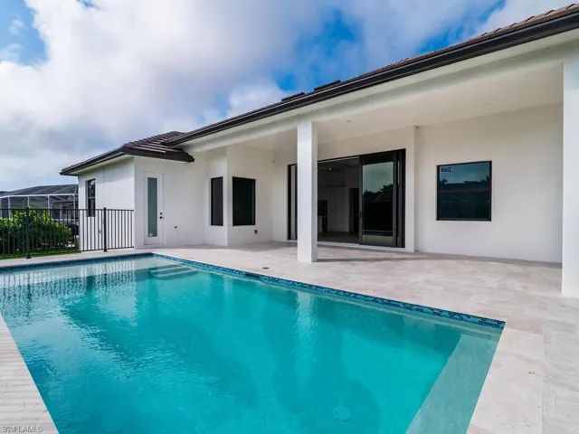 View of swimming pool featuring a fenced in pool and a patio area