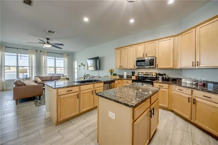 Central island and ample cabinets throughout