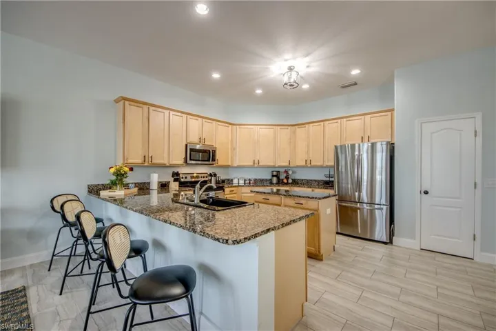 Spacious kitchen with tall cabinets