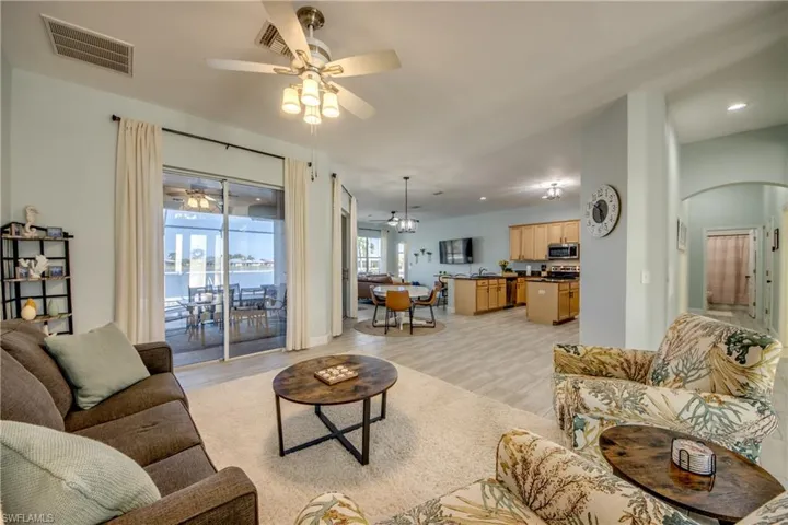 Living room with tiled  flooring and arched walkways