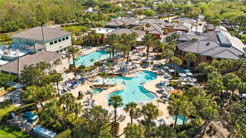 Expansive outdoor pool complex with multiple swimming pools, integrated spa, and surrounding lounge areas
