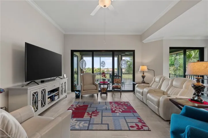 Crown molding accents the ceiling with a ceiling fan