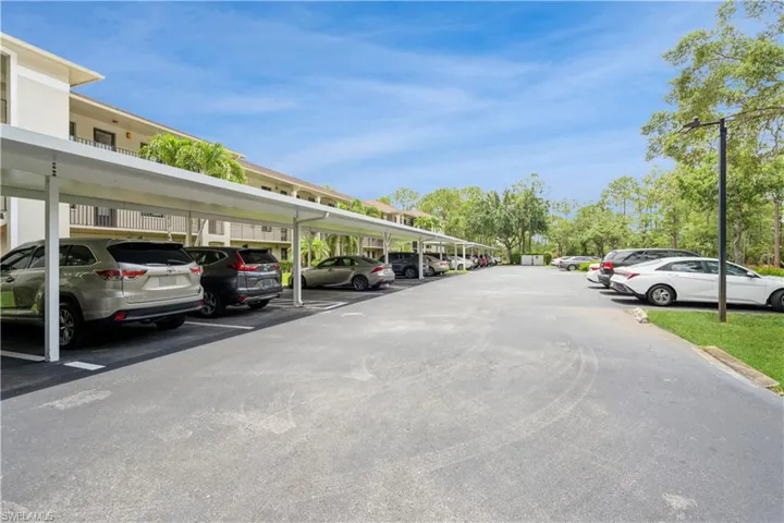 View of car parking featuring a carport