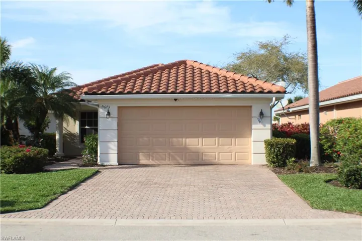 Mediterranean / spanish-style house with a garage