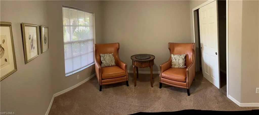 Living area featuring carpet flooring