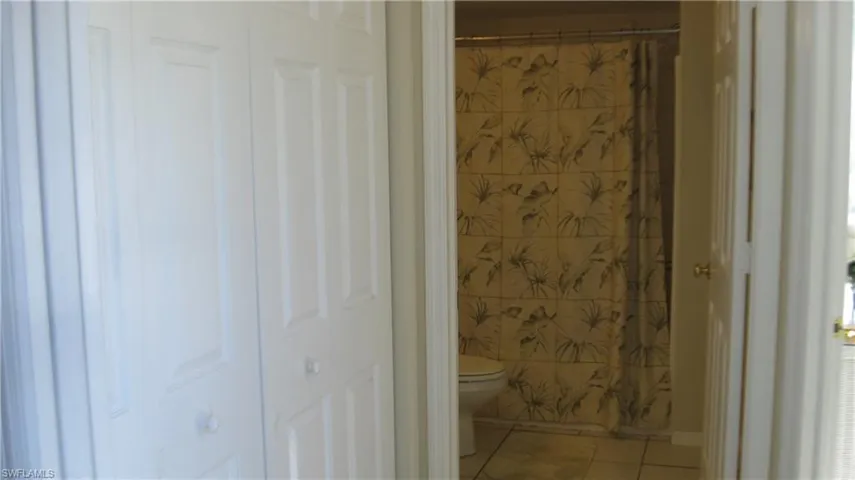 Hall closet with view to guest bath