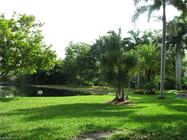Your back yard!   View of property's community featuring a yard and a water view