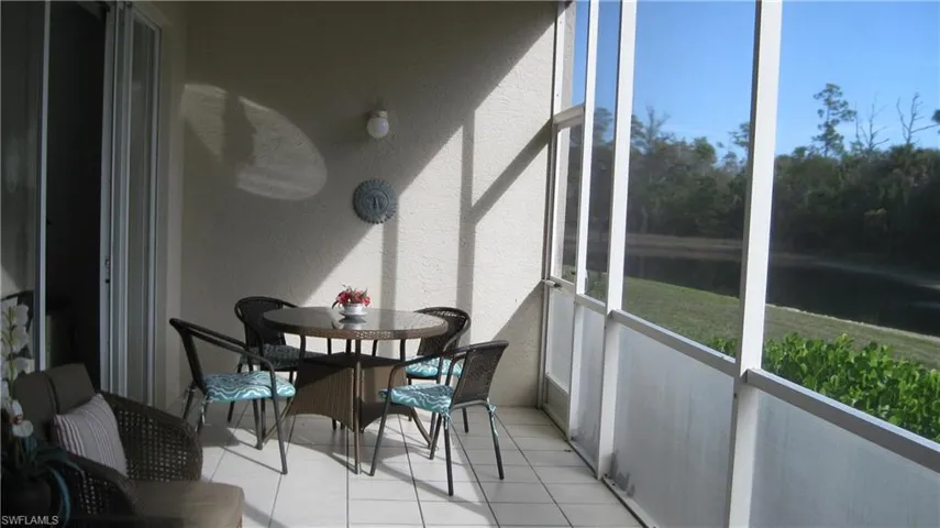 Lanai with a water view and plenty of natural light