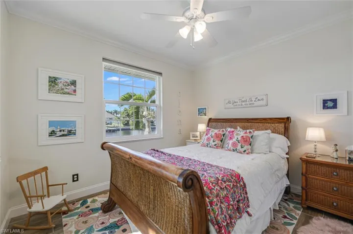 Bedroom featuring crown molding and ceiling fan