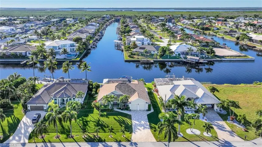 Aerial perspective of suburban area with a nearby body of water