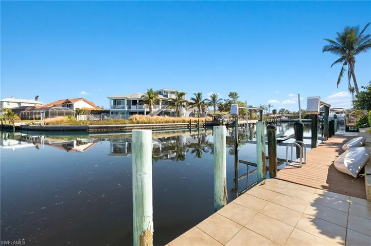 Dock with a water view and boat lift