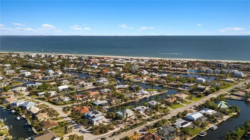 Aerial view of property's location featuring nearby suburban area