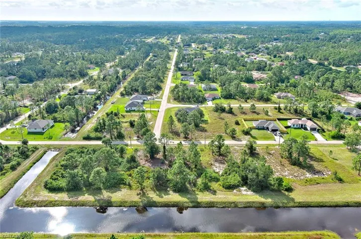 Aerial overview of property's location featuring a large body of water