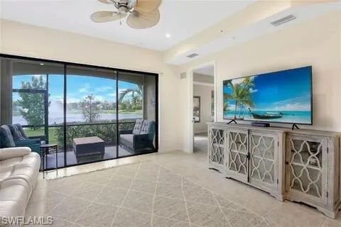 Living area with visible vents, ceiling fan, recessed lighting, and tile patterned flooring
