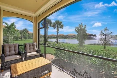 Sunroom / solarium with outdoor lounge area and a water view