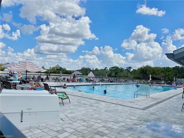 Community pool featuring a patio area