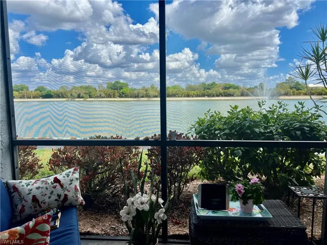 Balcony with a water view and a sunroom