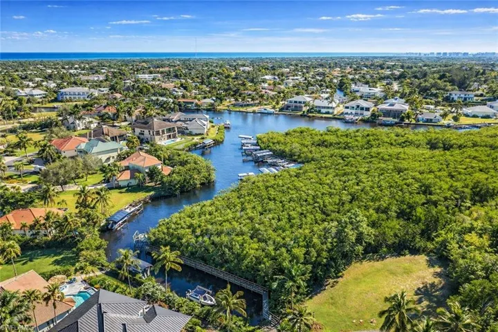 Aerial perspective of suburban area with a large body of water