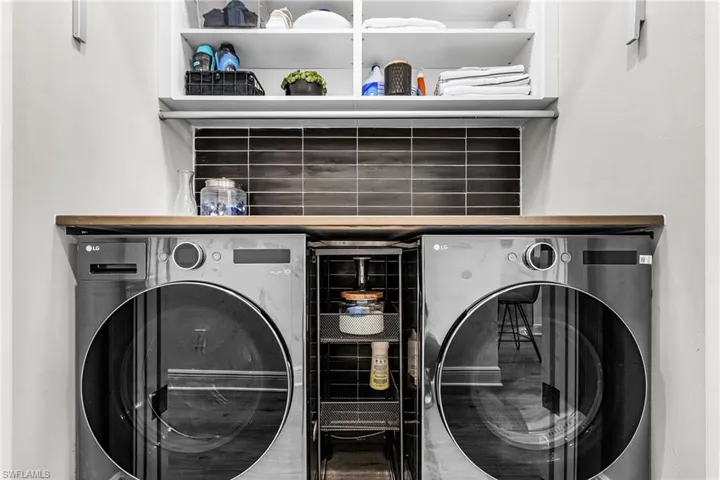 Laundry room featuring washing machine and clothes dryer