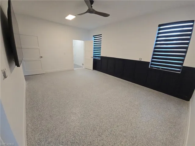 Empty room featuring ceiling fan