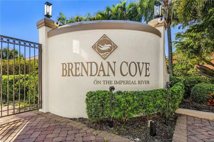Community / neighborhood sign with a gate