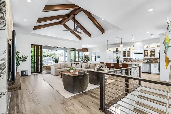 Living area featuring plenty of natural light, light wood-style floors, and recessed lighting