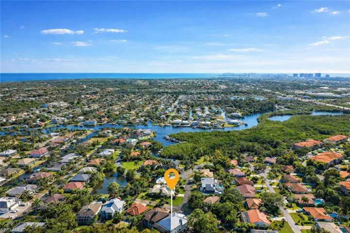 Aerial perspective of suburban area with a large body of water