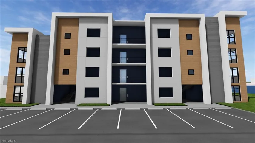 View of property featuring uncovered parking