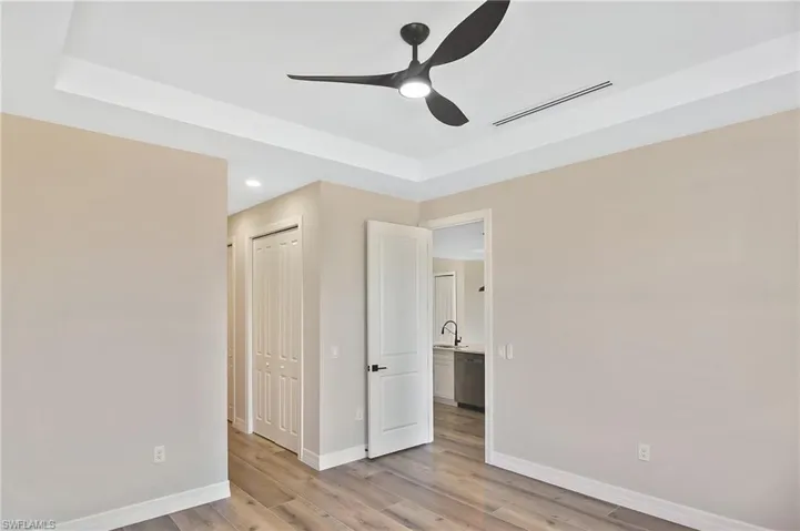 Tray ceiling with a modern black ceiling fan